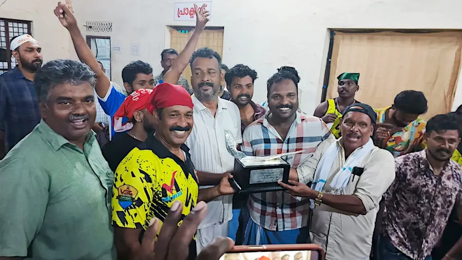 VBC Club officials and locals dance happily in Kainakari with the Nehru Trophy