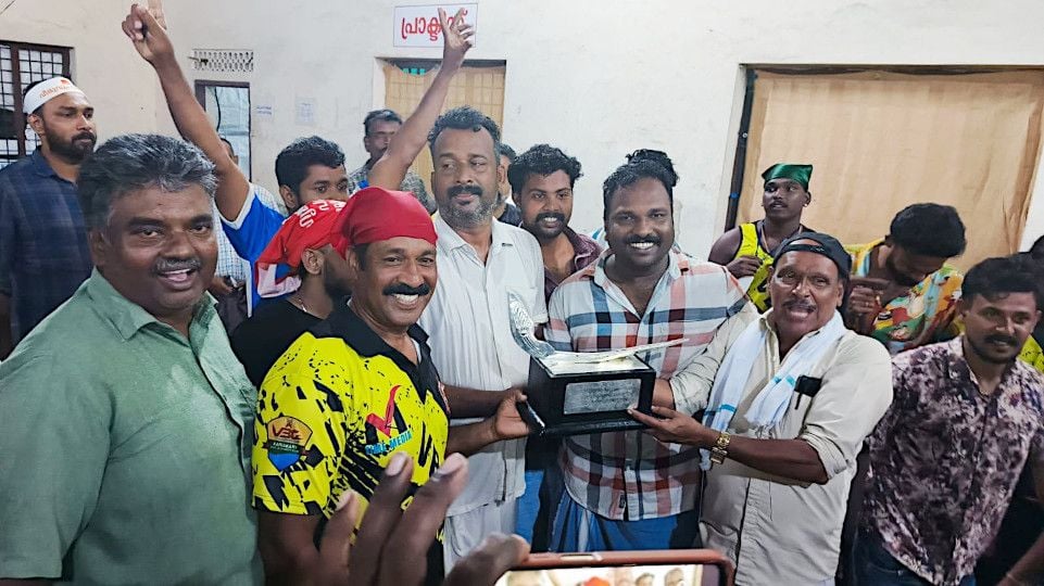 VBC Club officials and locals dance happily in Kainakari with the Nehru Trophy