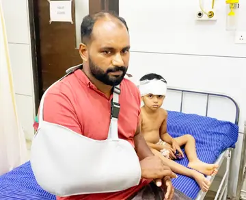 Father and three-year-old son injured after falling off scooter after stray dog jumps across