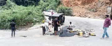 Potholes on the Thamarassery Ghat Road bends that cause people to fall.