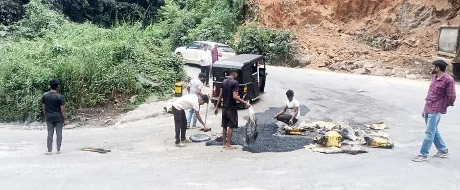 Potholes on the Thamarassery Ghat Road bends that cause people to fall.