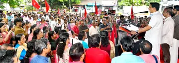Protests flare up in march by employees and teachers