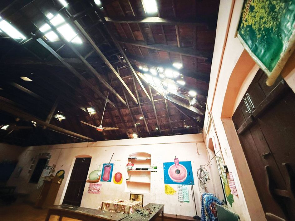 The roof of Cherianadu Cheruvallur Govt. JB School was damaged by a tree falling in the rain and wind.