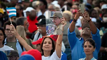 Cuban flag and a photograph of former Cuban president Raul Castro afp photo.jpg