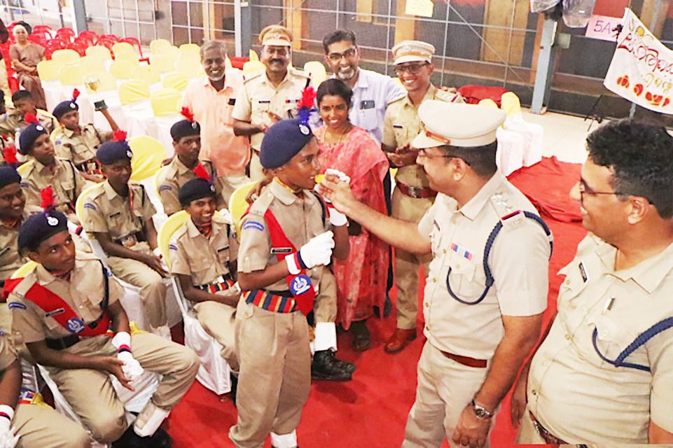 SHO Laizad Mohammed distributes sweets to the cadets of the only boys' platoon who participated in the district's Independence Day parade.