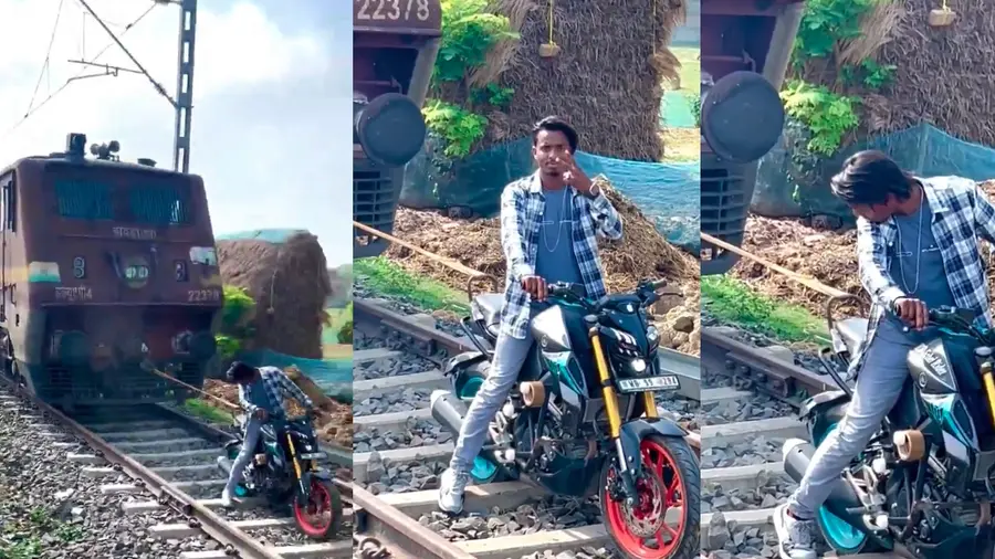Man Trying To Move Train With Bike