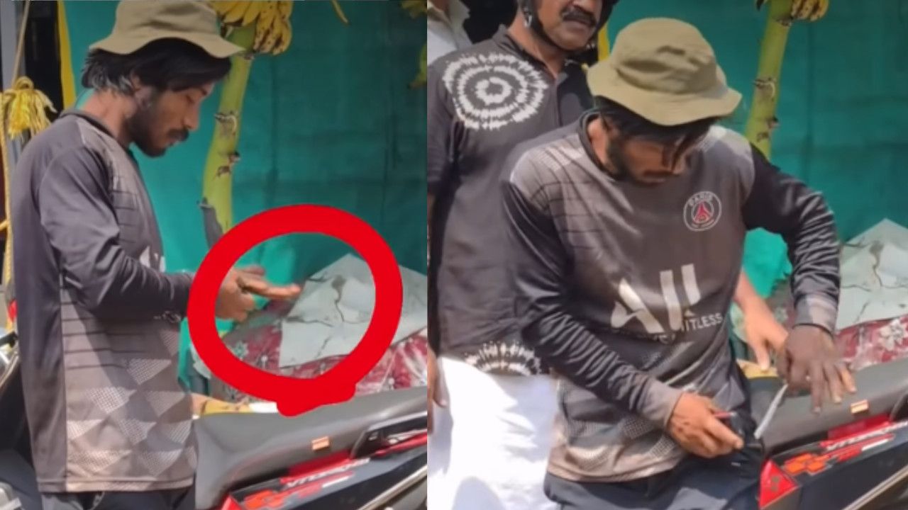 Migrant Worker Performs Dangerous Stunts with Snake .jpg