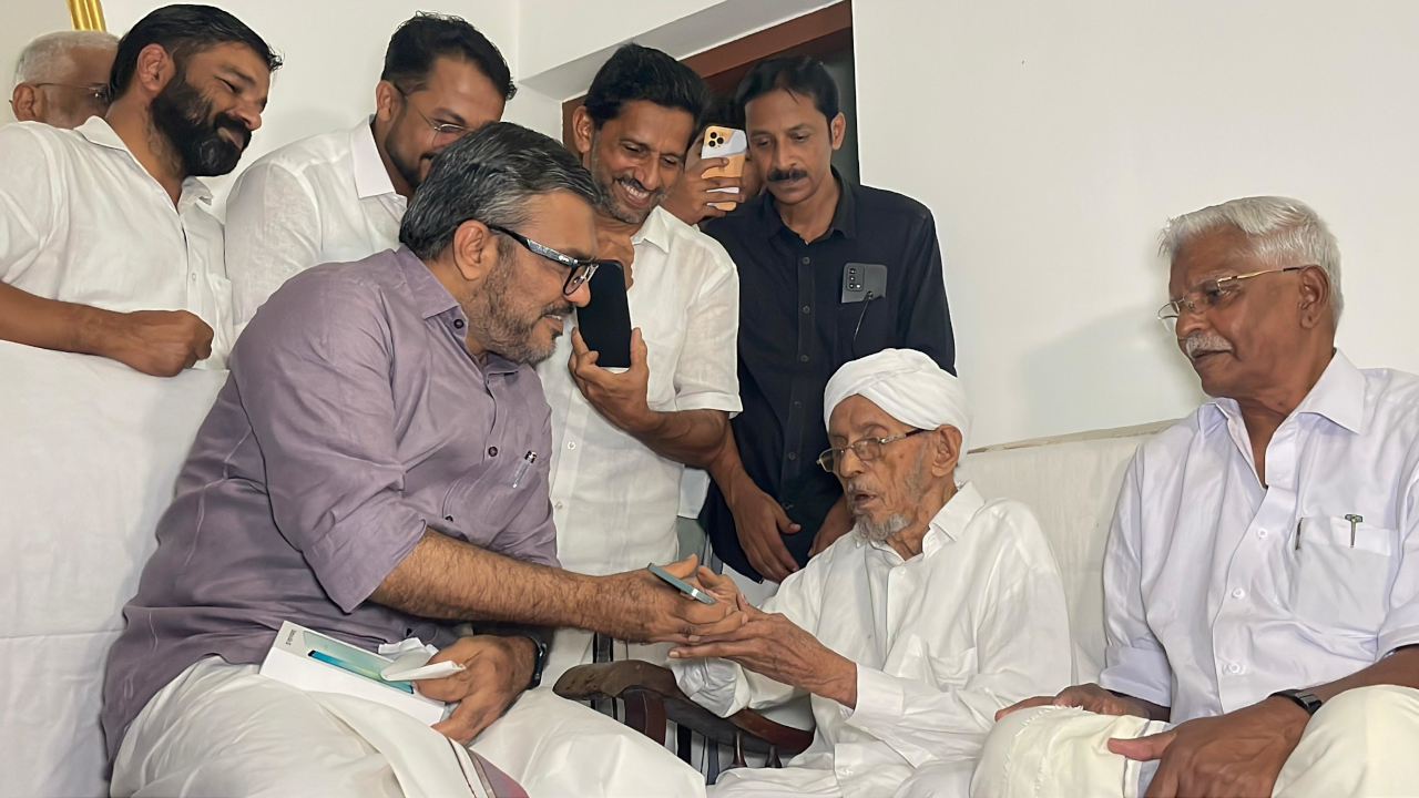 Minister M B Rajesh with Abdulla Moulavi