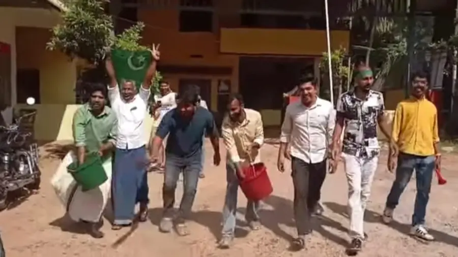 Muslim League Workers Spray Cow Dung.jpg