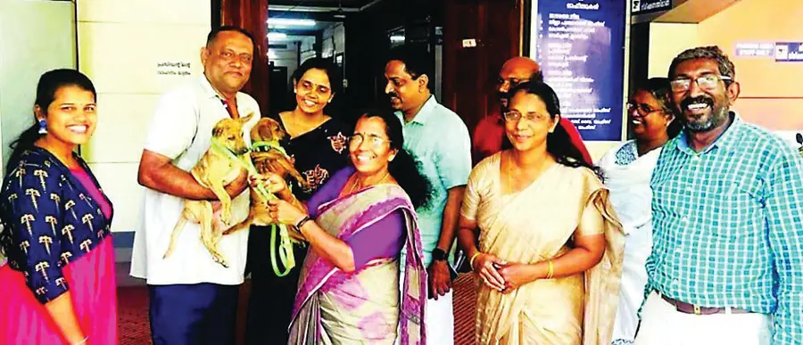 District Panchayat President K.G. Rajeshwari hands over Vasuki and Sundari to the Farm Superintendent.