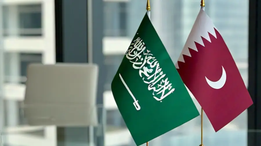 The flags of Saudi Arabia and Qatar