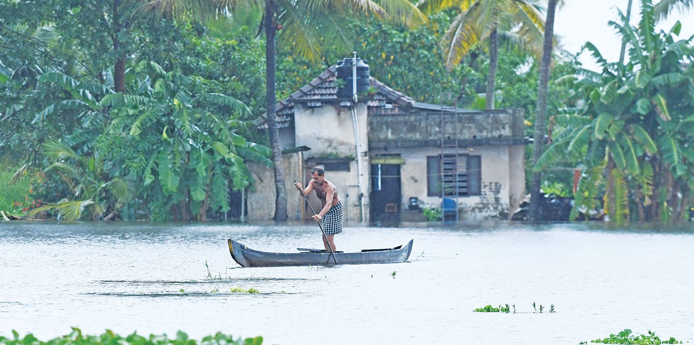 A house flooded after a paddy field overflowed due to heavy rains and rising eastern waters.