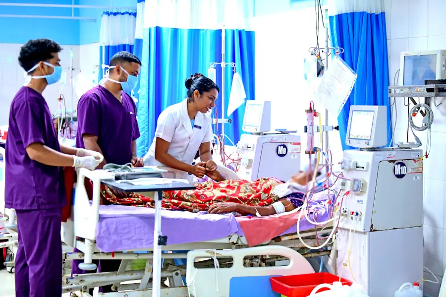 Dialysis in-charge nurse D Asha inquires about the patient's condition in the dialysis unit at Alappuzha General Hospital.