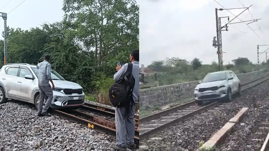 car driving on railway track