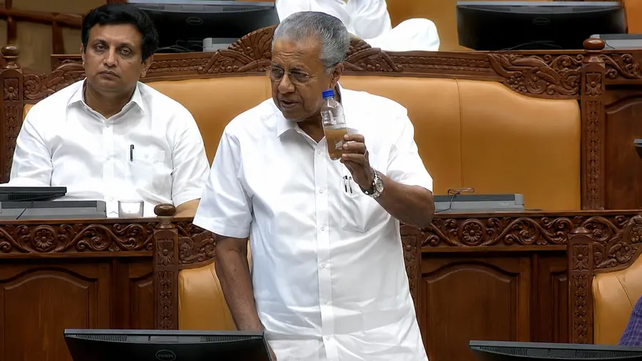 pinaraayi vijayan with Contaminated Water in niyamasabha