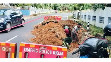 The road collapsed due to a burst pipe.
