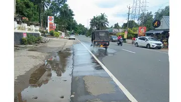 Pipe bursts; road collapses