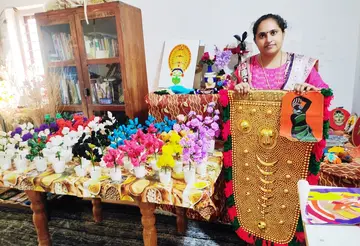 Sandhya is creating a spectacular display of colorful handicrafts.