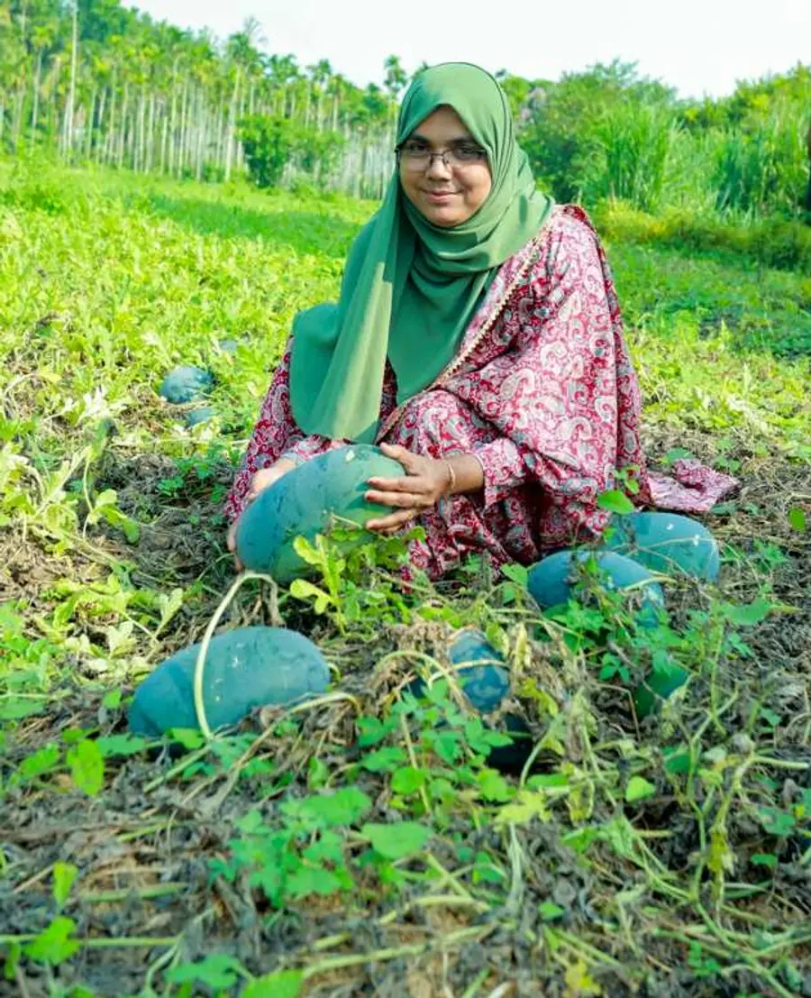 Etoli Pali Safiya of Pulparamba, Chennamangallur is overjoyed after harvesting her watermelon.